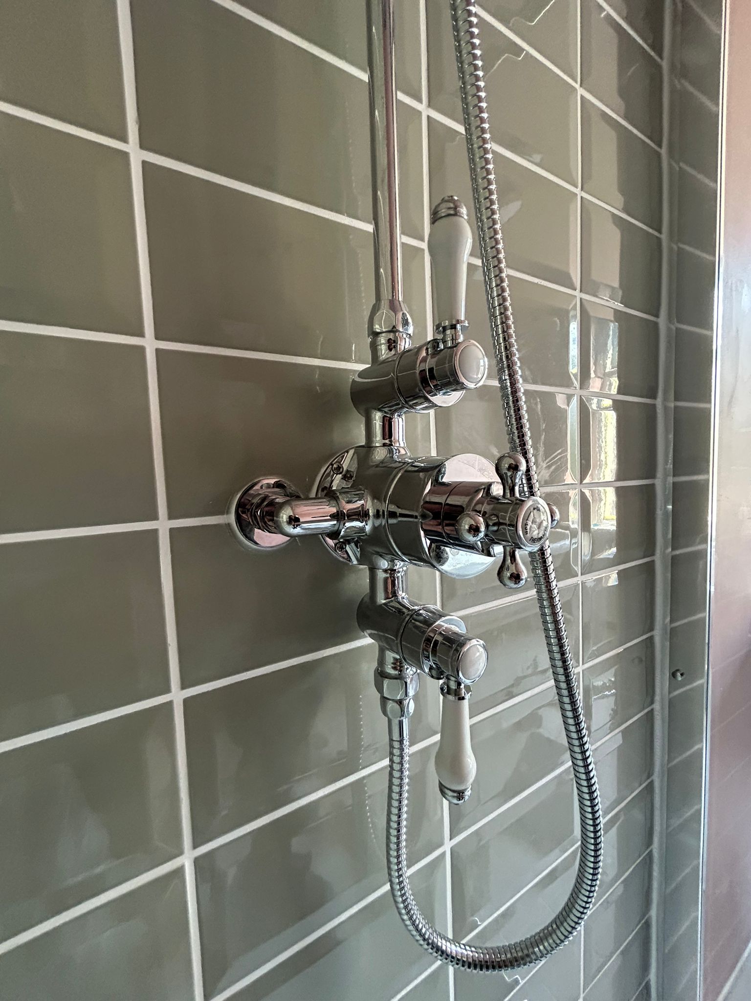 Grey Tiling and Chrome Shower Installed by MW Plumbing